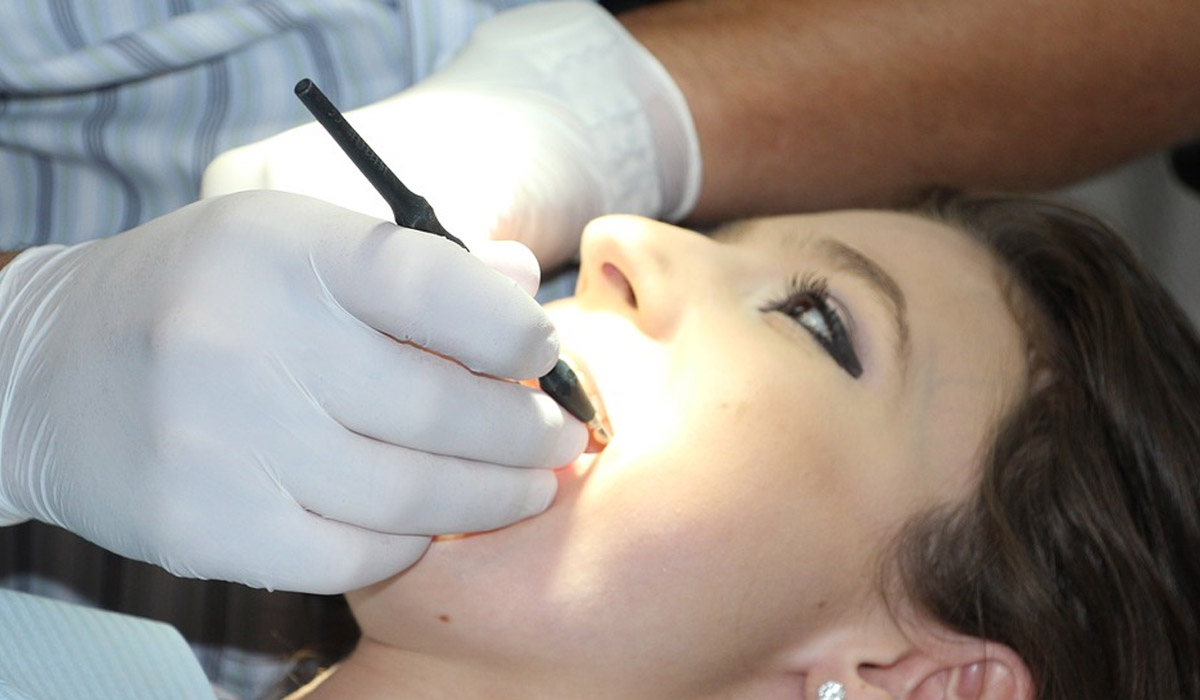 woman taking deep dental cleaning treatment
