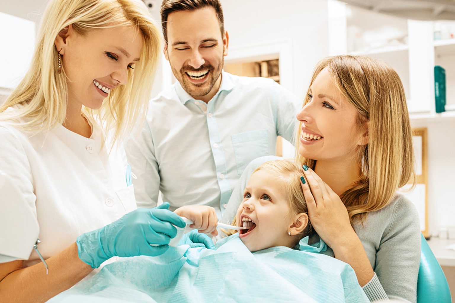 dentist explaining about infants early dental needs